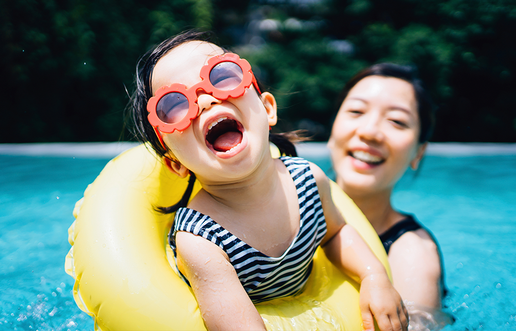 mother and daughter swimming