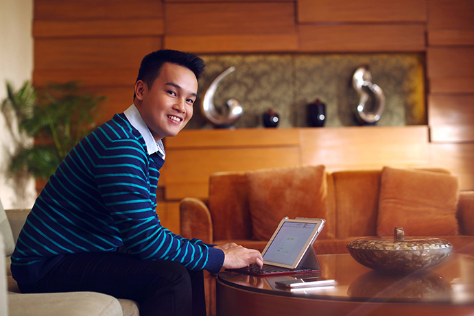 Juan Miguel A., Customer Service Representative and Skimboarder, Philippines Work Image. Image is available in high and low resolution. High resolution images should be used for print uses, low resolution images are for web or digital uses.