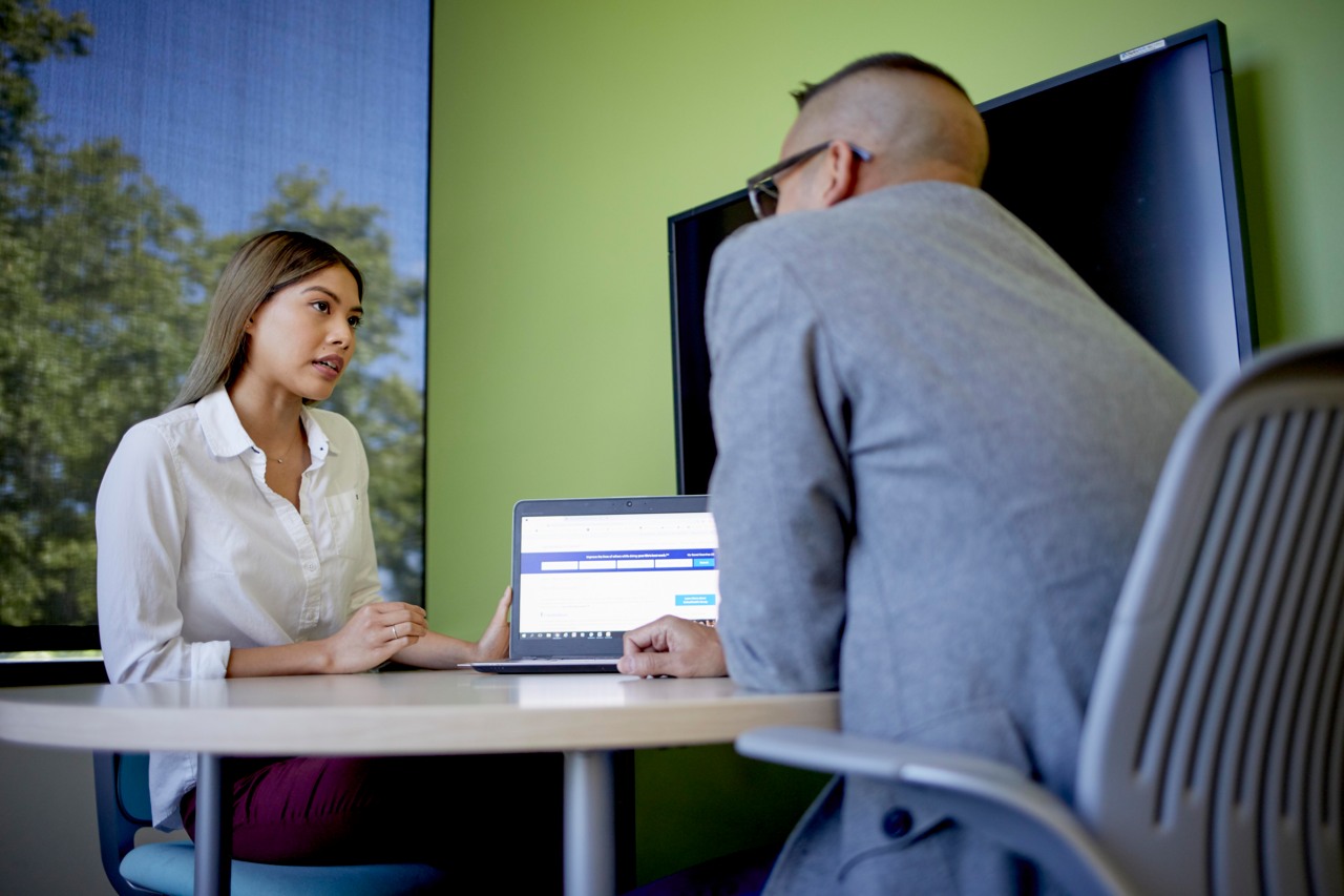Man and woman at desk