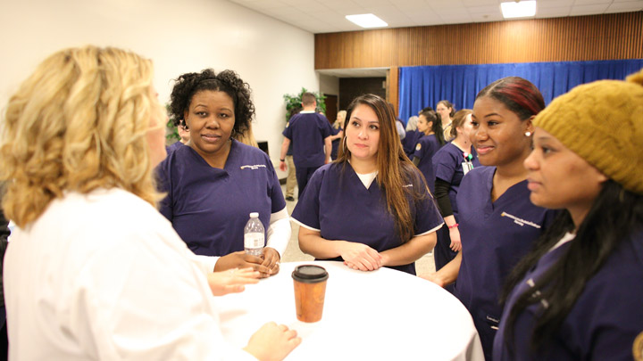 Medical professional speaks with nursing students