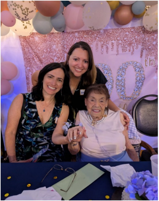 Tita Mirabal celebrating her 100th birthday with family and friends.