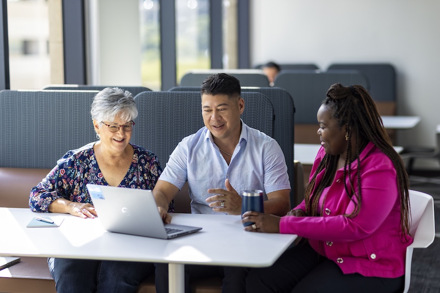 Employee, Meeting, Employee engagement, People, Business, Colleague, Laptop, Technology, Adult, Adults only, Businessman, Businesswoman, Cheerful, Happiness, Communication, Connection, Corporate business, Corporate culture, Discussion, Meeting, Coworker, Discussion, Office, Teamwork, Place of work, Working, Black, Hispanic, Asian, White, Breakroom, Patricia Contreras,  Shedralon Williams Cole, Lenny McDonald