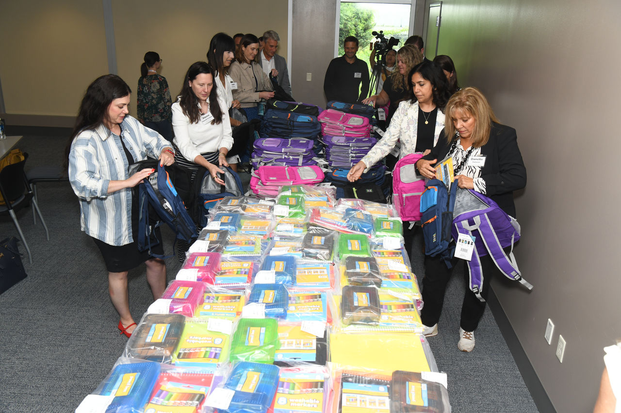 Volunteers fill backpacks