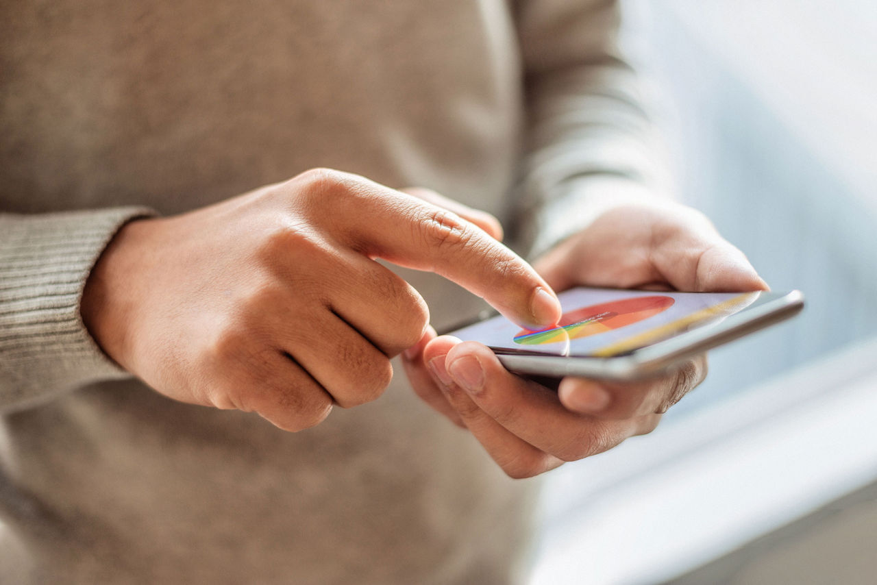 person pours pills into hand from pill bottle