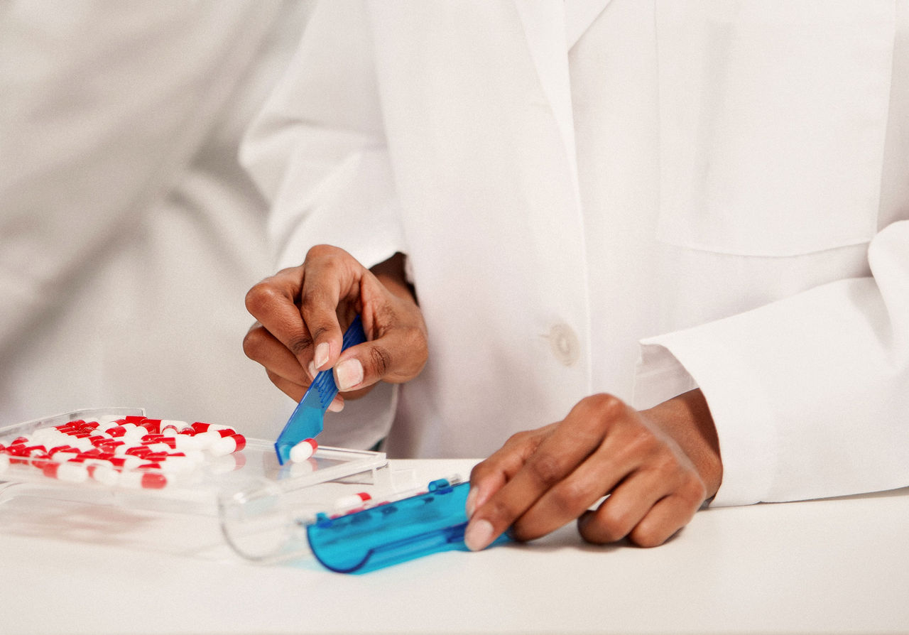 pill bottle and glass of water